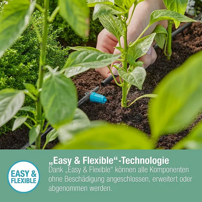 Gardena Micro-Drip Regulierbarer Reihentropfer - 10 Stk., 15 l/h - Nahaufnahme einer einfachen und flexiblen Gartenbewässerungsanlage zwischen grünen Pflanzen.