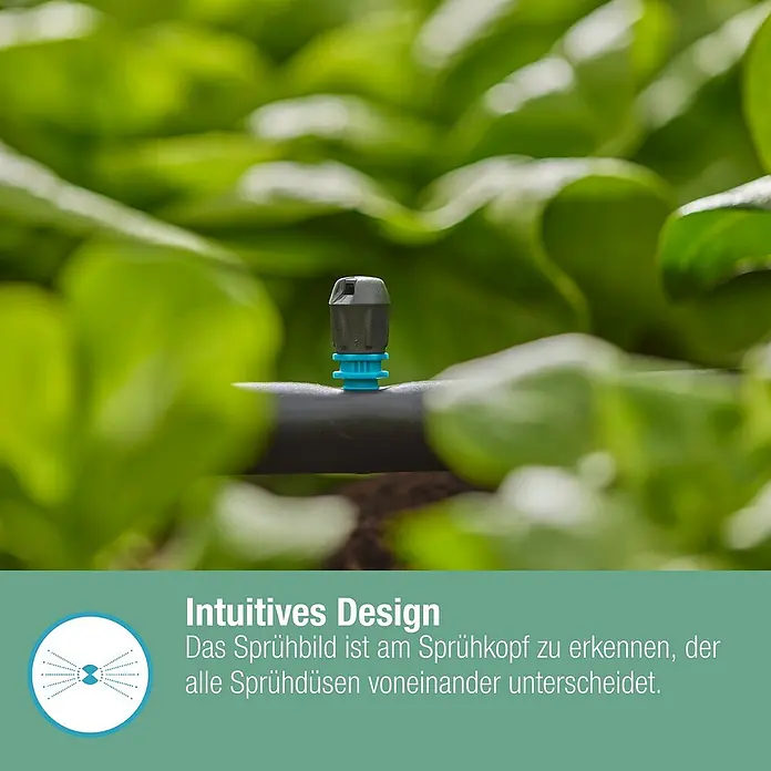Gardena Micro-Drip Streifendüse - 5 Stk., Wurfweite: 5,5 m - Nahaufnahme eines Bewässerungssprinklers inmitten von grünen Pflanzen.