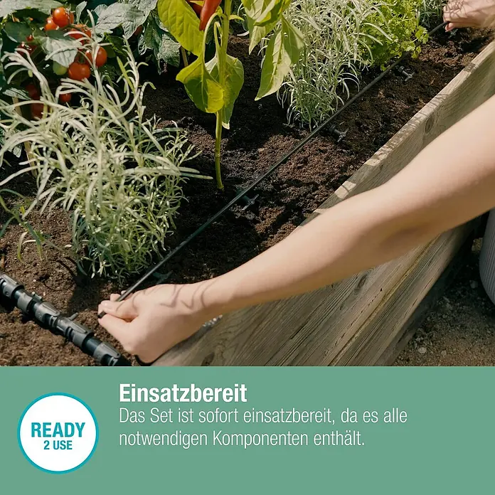 Gardena Micro-Drip Bewässerungs-Set Hochbeet/Beet Start-Set - 35 -tlg., Geeignet für: Reihenbewässerung, 35 Pflanzen - Detailaufnahme eines Bewässerungssystems in einem Hochbeet mit Tomaten, Kräutern und Paprika.