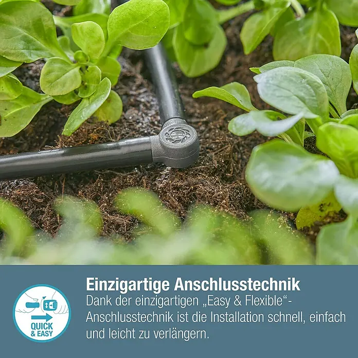 Gardena Micro-Drip L-Stück - Durchmesser Anschluss: 4,6 mm, 10 Stk., Kunststoff - Nahaufnahme eines Bewässerungssystems mit einzigartiger Anschlusstechnik inmitten von Pflanzen.