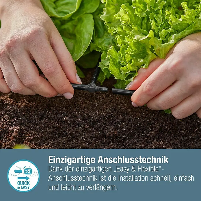 Gardena Micro-Drip T-Stück - 3/16" x 4,6 mm, 10 Stk. - Nahaufnahme einer Person, die ein T-Stück für ein Bewässerungssystem in einem Gartenbeet installiert.