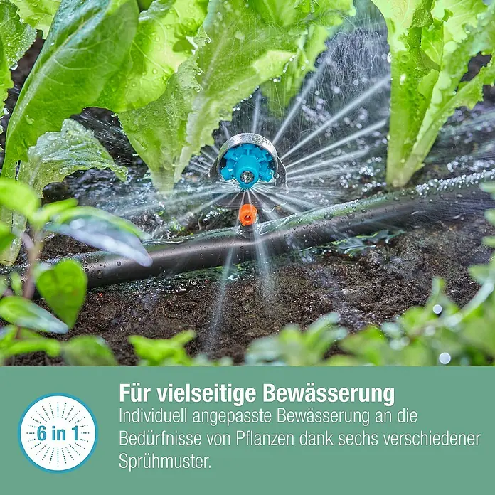 Gardena Micro-Drip Sprühdüse 6 in 1 - Durchmesser Anschluss: 13 mm, Quick & Easy-Verbindungstechnik - Bild einer Bewässerungsanlage, die Pflanzen effizient bewässert. Das System bietet sechs verschiedene Sprühmuster für individuelle Bedürfnisse.