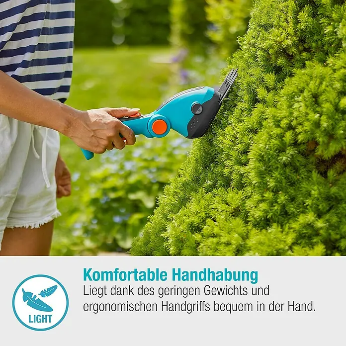 Gardena ComfortCut Akku-Gras- & Strauchschere Li - 3,6 V, Li-Ionen, 1 Akku, Schwertbreite: 8 cm - Eine Person benutzt eine Gardena Akku-Grasschere zur Gartenarbeit. Die Schere ist blau und orange.