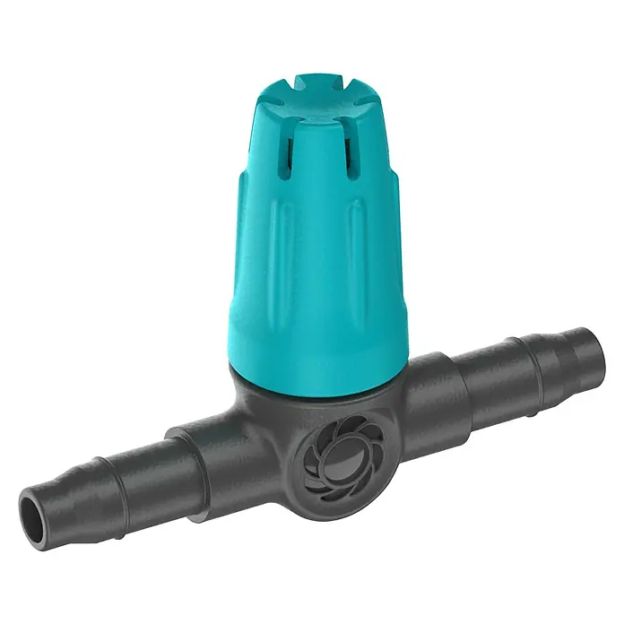 Gardena Micro-Drip Kleinflächendüse - 3/16" x 4,6 mm, 10 Stk. - Nahaufnahme eines tropfgrünen Bewässerungsreglers mit schwarzem T-Stück-Anschluss für Tropfbewässerungssysteme.