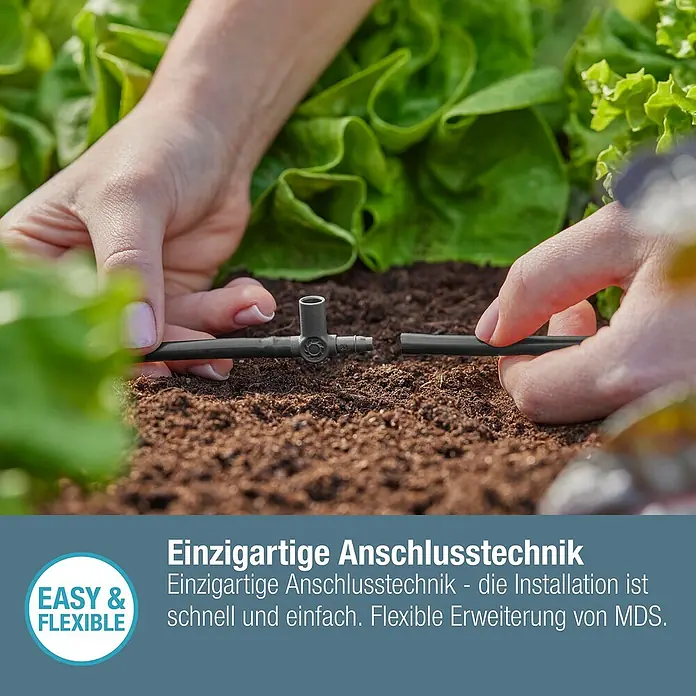 Gardena Micro-Drip T-Stück für Sprühdüsen & Endtropfer - 3/16" x 4,6 mm, 5 Stk. - Bewässerungssystem: Nahaufnahme einer Person, die ein Bewässerungssystem mit einzigartigen Anschlüssen installiert.