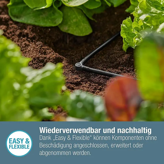 Gardena Micro-Drip L-Stück - Durchmesser Anschluss: 4,6 mm, 10 Stk., Kunststoff - Nahaufnahme eines Bewässerungssystems im Garten, umgeben von Salatpflanzen.