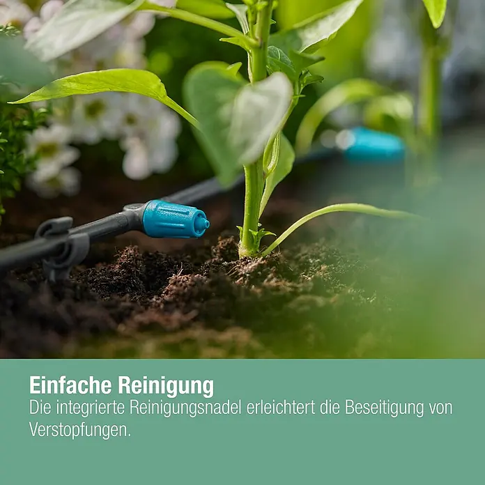 Gardena Micro-Drip Regulierbarer Reihentropfer - 10 Stk., 15 l/h - Nahaufnahme eines Bewässerungssystems für Pflanzen mit blauen Tropfern.
