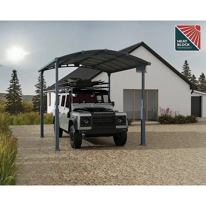 Palram – Canopia Carport Alpine - Medidas ext. (An x Pr): 3,59 x 4,35 m, Carport individual, Antracita - Una cochera gris que protege un Land Rover Defender gris, con tecnología Heat Block para una protección óptima.