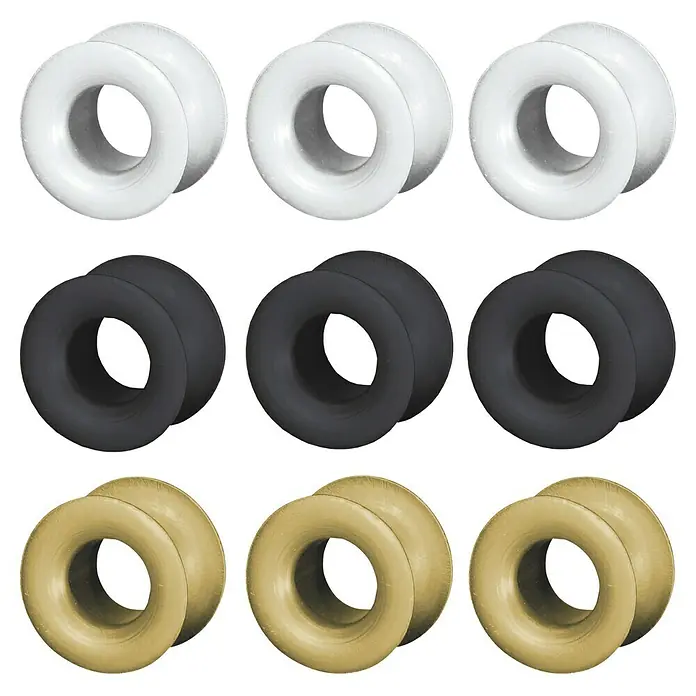 ETI Neozed-Passeinsatz VD02 - 9 Stk. - Nahaufnahme von neun Ohrloch-Dehnungsringen in Weiß, Schwarz und Gold, die ein modisches Accessoire darstellen.