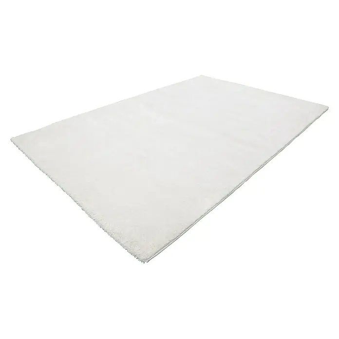 Kurzflorteppich Softtouch - Elfenbein, 150 x 80 cm, 100 % Polypropylen (Flor) - Ein rechteckiger, flauschiger, weißer Teppich liegt auf einem schwarzen Hintergrund. Perfekt für jeden Raum, verleiht er Komfort und Stil.