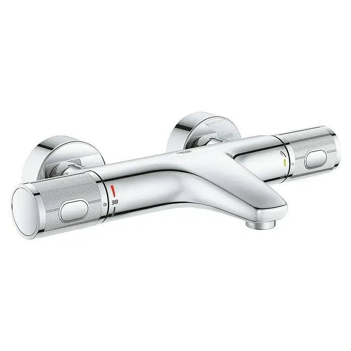 Grohe Precision Feel Wannenthermostat - Chrom, Glänzend - Nahaufnahme einer glänzenden Chrom-Thermostat-Duscharmatur mit Temperaturreglern und Sicherheitsknopf für eine sichere und komfortable Dusche.
