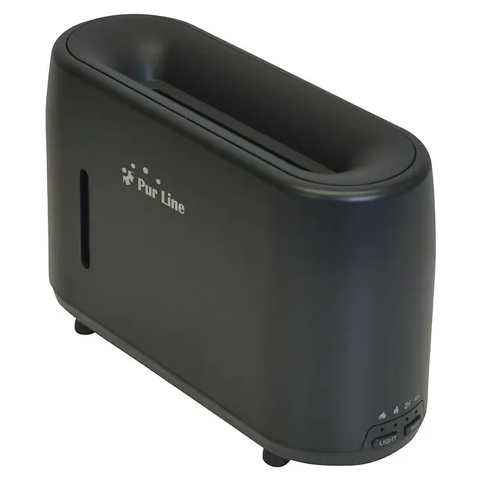 Purline Humidificador y difusor de aromas Sumu Fire - 8 x 20 x 11 cm, Negro - En la imagen se muestra un difusor de aroma Pur Line de color oscuro. El dispositivo es compacto y tiene una forma alargada con bordes redondeados.