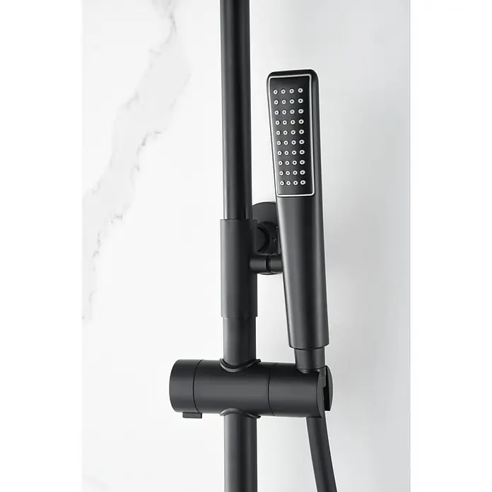 Imex Nápoles Sistema de ducha - Grifo termostático, Negro - Grifo de ducha negro con ducha de mano sobre una pared de mármol.