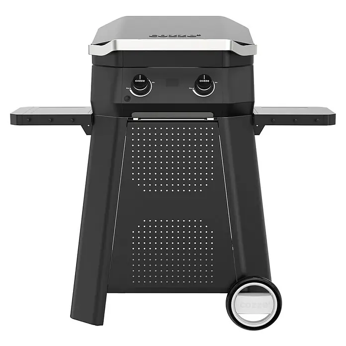 Cozze Carro con ruedas - An x Pr x Al: 127 x 64,5 x 74,5 cm, Acero, Negro, Específico para: Parrillas Cozze serie 500 - Imagen de una barbacoa de gas Cozze con dos mesas laterales, perfecta para cocinar al aire libre.