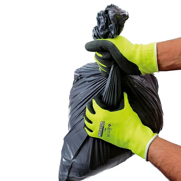 Juba Guantes de trabajo 258 Reflector - Talla del guante: 10, Amarillo/Negro, 2 ud. - Manos con guantes de trabajo amarillos sujetando una bolsa de basura negra.