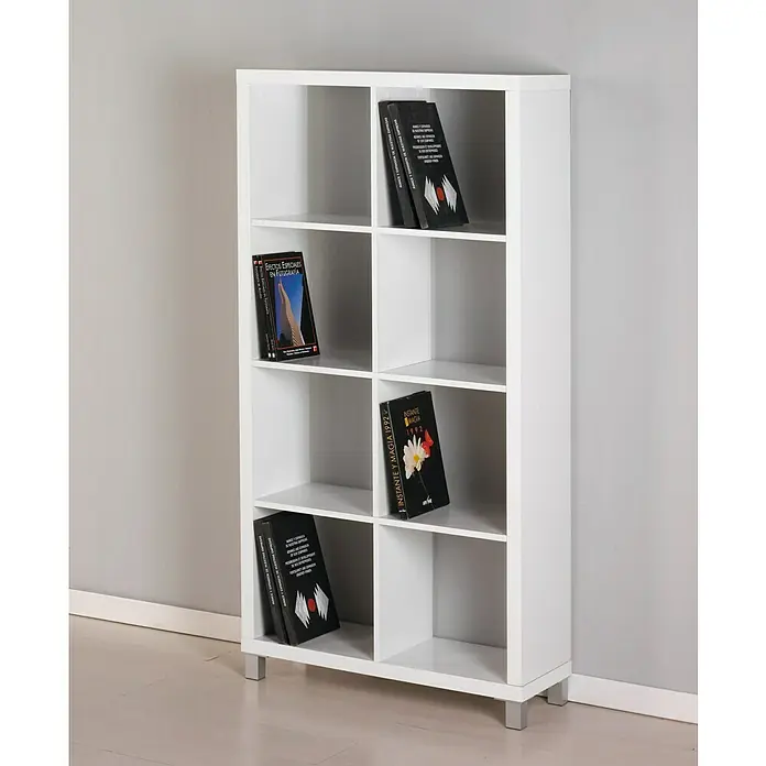 Estantería de madera Kubox - Al x An x Pr: 153 x 76 x 29 cm, Número de baldas: 8 ud., Blanco - Una estantería blanca con ocho compartimentos y algunos libros en su interior, apoyada contra una pared gris.