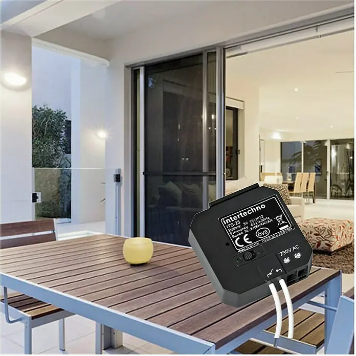 Intertechno Funk-Sendermodul Dual ITS-23 - Passend für: Intertechno Empfänger, Reichweite ca.: 30 m - Abbildung eines Intertechno ITS-23 Funk-Schaltmoduls für eine smarte Haussteuerung mit 230V AC Anschluss und diversen Funkfrequenzen.