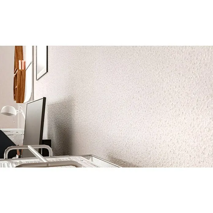 swingcolor effects Flüssige Raufaser Wohnraumfarbe mit Raufaser-Effekt - Weiß, 10 l, Matt - Detailaufnahme eines Arbeitsplatzes mit einem modernen Monitor, einer Lampe und einem hellen, strukturierten Hintergrund, der eine ruhige Arbeitsatmosphäre schafft.