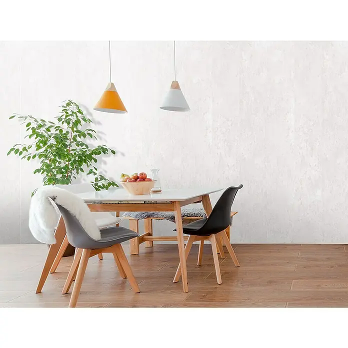 Bariperfil Revestimiento de pared de PVC Soft Concrete - 260 x 33,3 cm, Concrete - Comedor con mesa, sillas y lámparas. La decoración escandinava presenta un diseño moderno y luminoso y un ambiente acogedor.