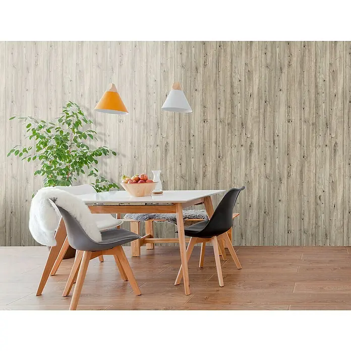 Bariperfil Revestimiento de pared de PVC Roble Rústico - 260 x 33,3 cm, Roble Rústico - La imagen muestra un elegante comedor con una pared de paneles de madera clara que crea un ambiente cálido y acogedor.