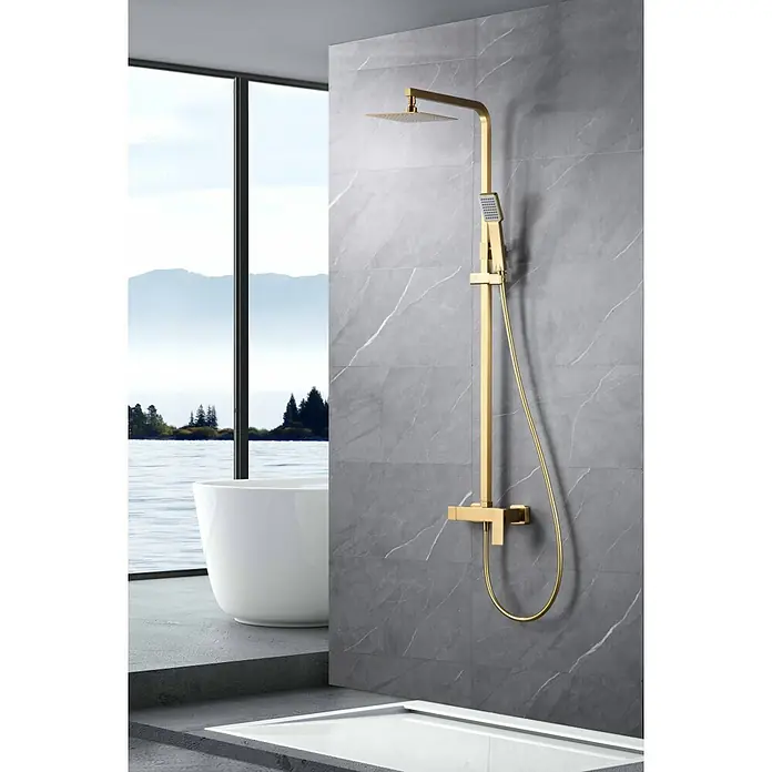 Imex Pisa Sistema de ducha - Grifo monomando, Oro - Grifo de ducha dorado con cabezal y ducha de mano sobre pared de mármol gris. Diseño elegante de baño para una ducha lujosa.