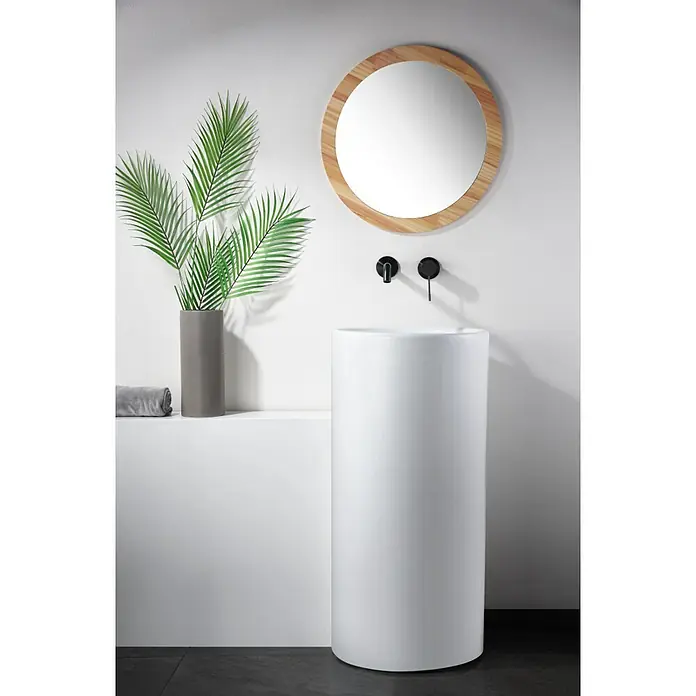 Imex Génova Grifo de lavabo - Black gun metal - Moderno baño con lavabo de pedestal blanco, espejo redondo con marco de madera y plantas verdes. Diseño elegante para el baño.