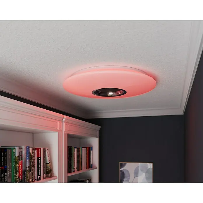 Tween Light LED-Deckenleuchte rund - 24 W, Weiß, RGBW - Nahaufnahme einer runden, an der Decke montierten Lampe mit roter Beleuchtung, die eine moderne und stilvolle Atmosphäre schafft.