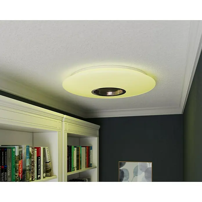 Tween Light LED-Deckenleuchte rund - 24 W, Weiß, RGBW - Diese Nahaufnahme zeigt eine moderne Deckenleuchte mit einem warmen Lichtschein, der den Raum erhellt.