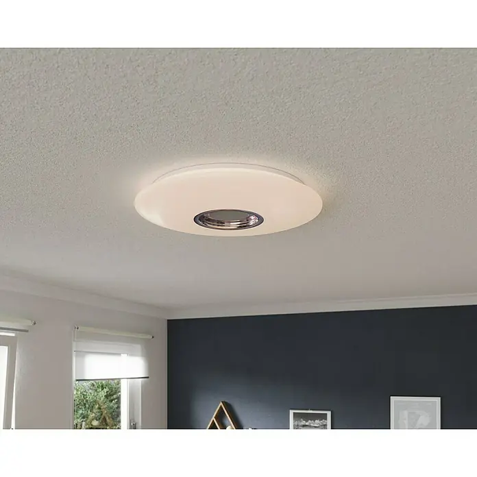 Tween Light LED-Deckenleuchte rund - 24 W, Weiß, RGBW - Eine moderne, runde Deckenleuchte in Weiß mit einem silberfarbenen Akzent in der Mitte, die ein helles und gleichmäßiges Licht verbreitet.