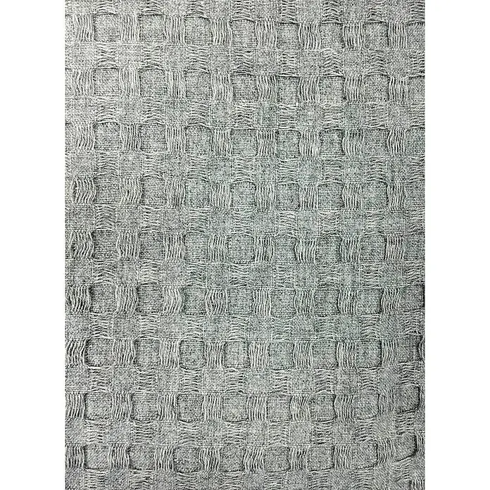 Manta para sofá Multiusos Waffle - Textil, Gris - Primer plano de una toalla de gofre gris, que muestra su interesante textura y patrón de pequeños cuadrados.\n