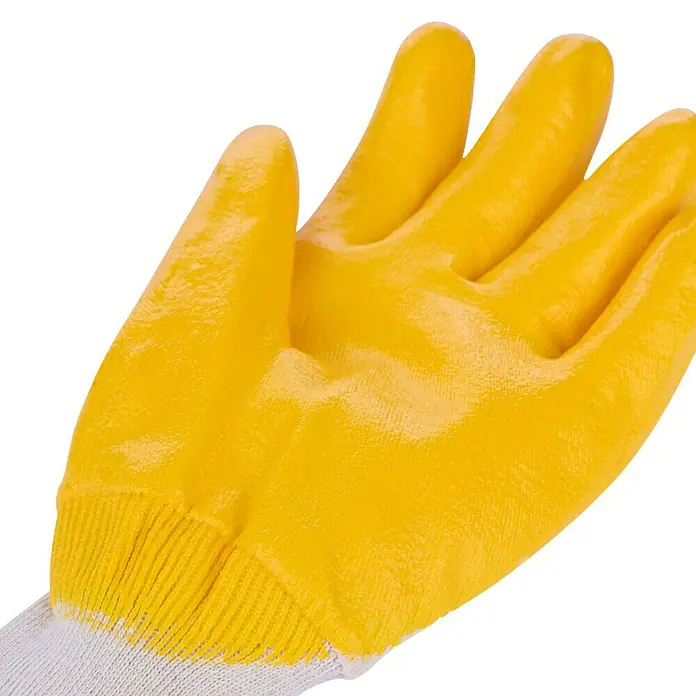 Guide Arbeitshandschuhe 807 PP - Gelb, 10 - Nahaufnahme eines gelben Arbeitshandschuhs mit weißem Strickbund, ideal für Garten- und Bauarbeiten.