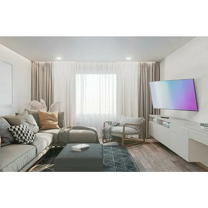 Hama TV-Wandhalterung schwenkbar - Passend für: Bildschirmdiagonale 32 - 65″, 81 - 165 cm, Belastbarkeit: 30 kg, Wandabstand: 2,5 cm - 41 cm - Wohnzimmer mit Ecksofa, Sessel und TV-Wand. Das Ecksofa und der Sessel bieten gemütliche Sitzgelegenheiten, während die TV-Wand für Unterhaltung sorgt.