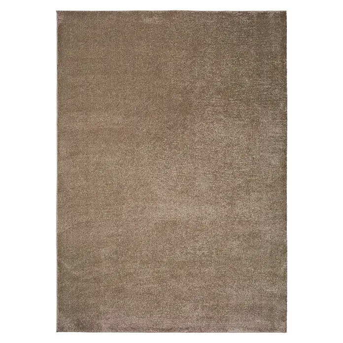 Alfombra de pelo corto Montana - Beige, 120 x 60 cm, 100% Polipropileno - Primer plano de una alfombra beige con una textura sutil, ideal para espacios habitables y que complementa varios estilos de decoración.