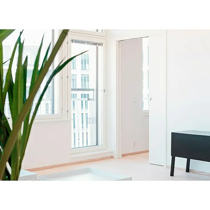 Eclisse Estructura de puerta corredera para pared de obra - 90 x 202 cm, Acero, 10,8 cm - Interior luminoso y minimalista con un enfoque en un gabinete moderno. Las líneas limpias y el diseño sencillo destacan su elegancia.