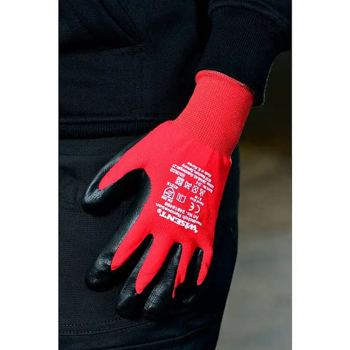 Wisent Arbeitshandschuhe Renovation - Schwarz/Rot, 10 - Nahaufnahme eines roten WISENT Handschuhs Renovation mit schwarzer Handfläche. Ideal für Renovierungsarbeiten und bietet guten Schutz.