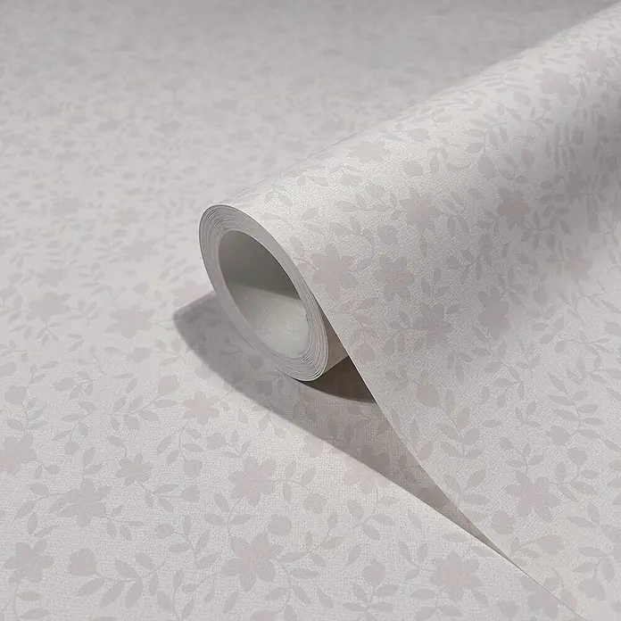 Marburg Heritage Vliestapete mit feinen Blättern - Rosa, Floral, 10,05 x 0,53 m - Nahaufnahme einer Rolle zart gemusterter, weißer Tapete, ideal für die Wandgestaltung und Inneneinrichtung.