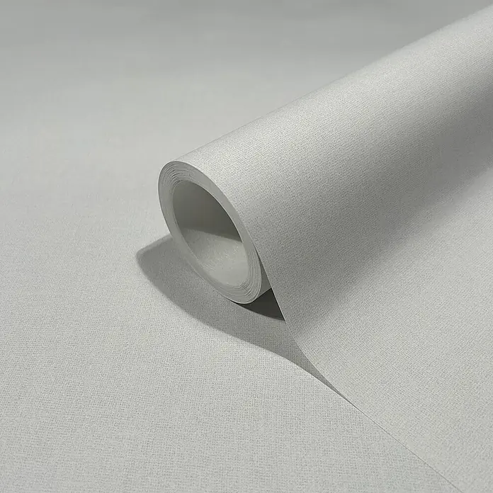 Marburg Heritage Vliestapete Glatte Struktur - Grau, Uni, 10,05 x 0,53 m - Nahaufnahme einer Rolle hochwertiger, grauer Vinyltapete mit dezenter Textur, ideal für stilvolle Wandgestaltungen.