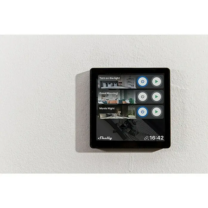 Shelly Touchscreen-Bediengerät Wall Display - Schwarz, 30 x 85 x 85 mm - Nahaufnahme eines Shelly Smart Home-Touchpanels an einer weißen Wand, das verschiedene Lichtszenen wie "Turn on the light" steuert.