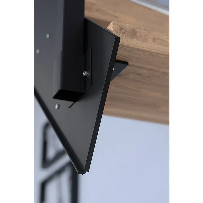 Starwood Wangentreppe KosFarbton Metall: RAL 9005, Breite: 108 cm, Eiche, Geschosshöhe: 260 cm - 320 cm, Gerade, Designgeländer unbehandelt, Stufen unbehandelt - Detailaufnahme eines schwarzen Tisches mit hölzerner Tischplatte, der die Verbindung von modernem Design und natürlicher Ästhetik zeigt.