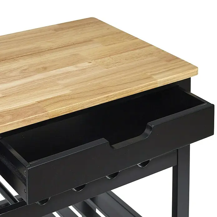 Home Deco Factory Carro de cocina Bristot Indus - L x An x Al: 40 x 62,5 x 85,5 cm, Negro/Pino - Vista detallada de un carrito de isla de cocina con una tapa de madera clara y un cajón negro parcialmente abierto.