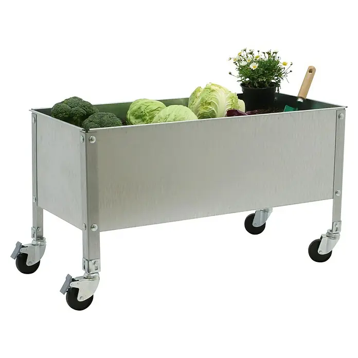 Simonrack Simongarden Huerto Urbano Urban Mob - 60 x 120 x 52,5 cm, Aluminio, Galvanizado - La imagen muestra una jardinera plateada con ruedas llena de varias verduras y una planta en maceta. Ideal para la jardinería móvil.