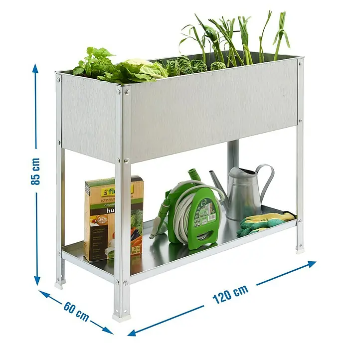 Simonrack Simongarden Mesa de cultivo Urbano Urban Top - 60 x 120 x 85 cm, Aluminio, Galvanizado - La imagen muestra una mesa de jardinería elevada de metal con plantas, herramientas de jardinería y embalaje de productos con dimensiones de 85 cm de alto, 60 cm de profundidad y 120 cm de ancho.