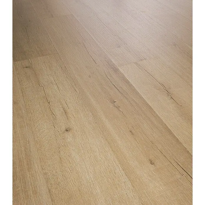 Laminado Roble Serena - 1.380 x 193 x 12 mm, AC5 - Primer plano de suelo laminado de color claro, que muestra su textura de madera natural y superficie duradera. Ideal para espacios modernos.