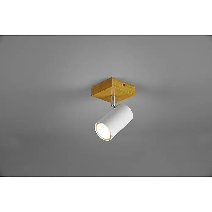 Trio Leuchten Marley Deckenstrahler - 15 W, L x B x H: 12 x 9 x 16 cm, Weiß/Holz, GU10, 1 Stk. - Nahaufnahme einer modernen Deckenleuchte mit Holzsockel und weißem, zylindrischem Strahler, die ein warmes Licht in den Raum wirft.