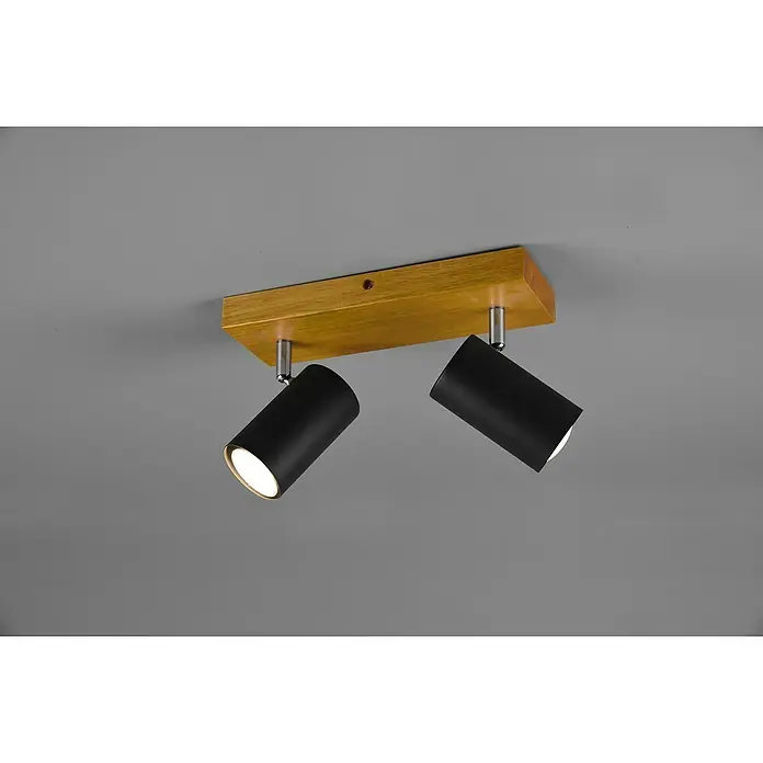 Trio Leuchten Marley Deckenstrahler - 70 W, L x B x H: 9 x 26 x 16 cm, Schwarz, GU10, 2 Stk. - Nahaufnahme einer Deckenleuchte mit Holzsockel und zwei verstellbaren schwarzen Strahlern, die ein warmes Licht ausstrahlen.