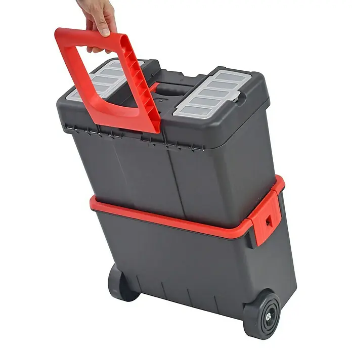 Fulmo Caja profesional con ruedas - L x An x Al: 26 x 62,5 x 46 cm, Polipropileno - Una caja de herramientas rodante con asa roja y compartimentos negros. La caja es ideal para transportar herramientas y accesorios.