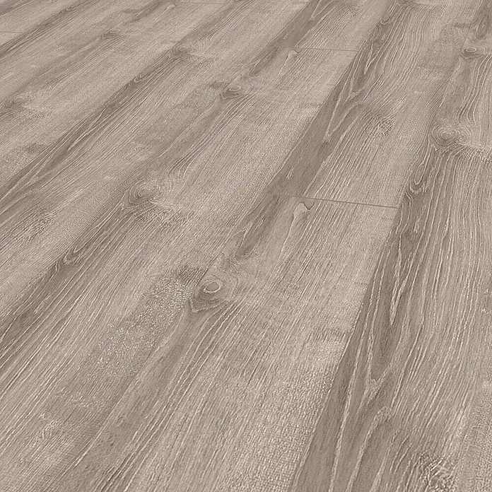 Laminado Roble Cuarzo - 1.380 x 193 x 10 mm, AC5 - Primer plano de un suelo laminado con un grano de madera detallado, que crea un ambiente cálido y acogedor.