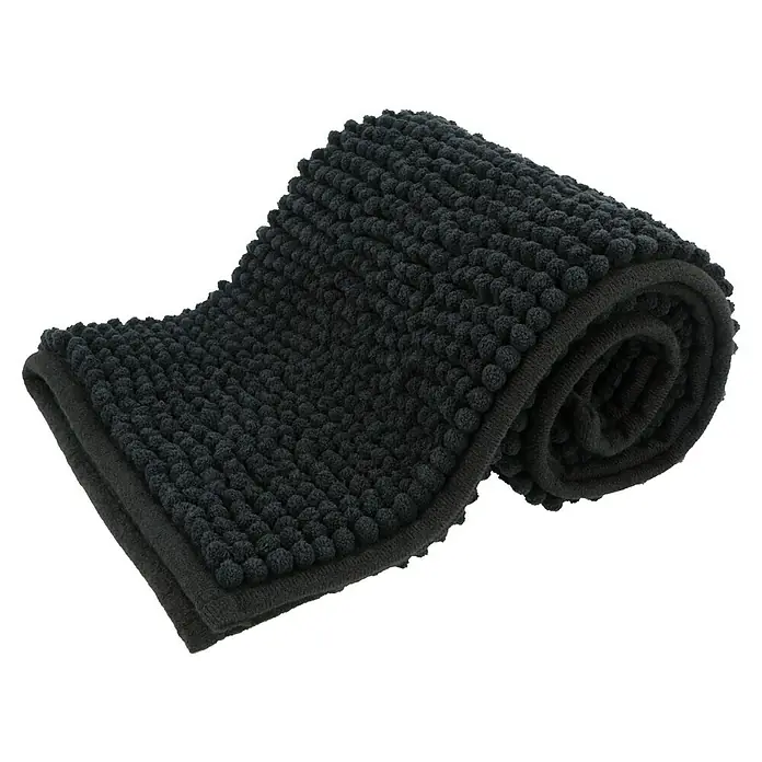 Set de accesorios de baño Today - Plástico, Negro, 4 pzs. - Una alfombra de baño gris oscuro, parcialmente enrollada, con una superficie de bolitas. Ofrece comodidad y estilo a tu baño.