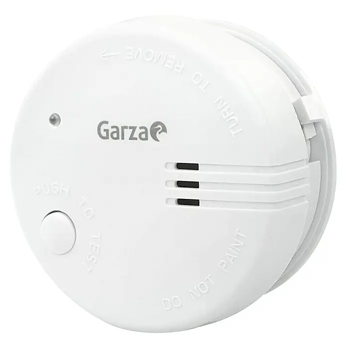 Garza Detector de humo Standart - Diámetro: 10,3 cm, Duración de batería: 5 años, Señal de alarma: 85 dB, 2 ud. - Primer plano de un detector de humo Garza blanco, un dispositivo esencial para la seguridad del hogar.\n