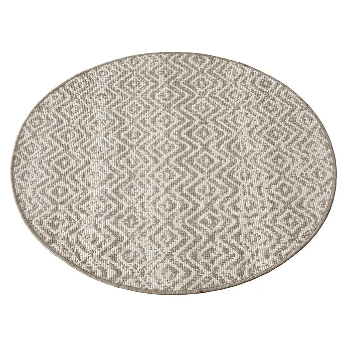 Alfombra exterior reversible Rombo - Beige, Diámetro: 100 cm, Polipropileno - Alfombra redonda con un patrón geométrico de rombos en tonos neutros. La alfombra tiene un borde sutil y se muestra sobre un fondo negro.